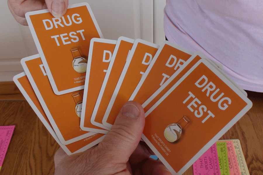 Orange Cards Splayed Out That Say Drug Test